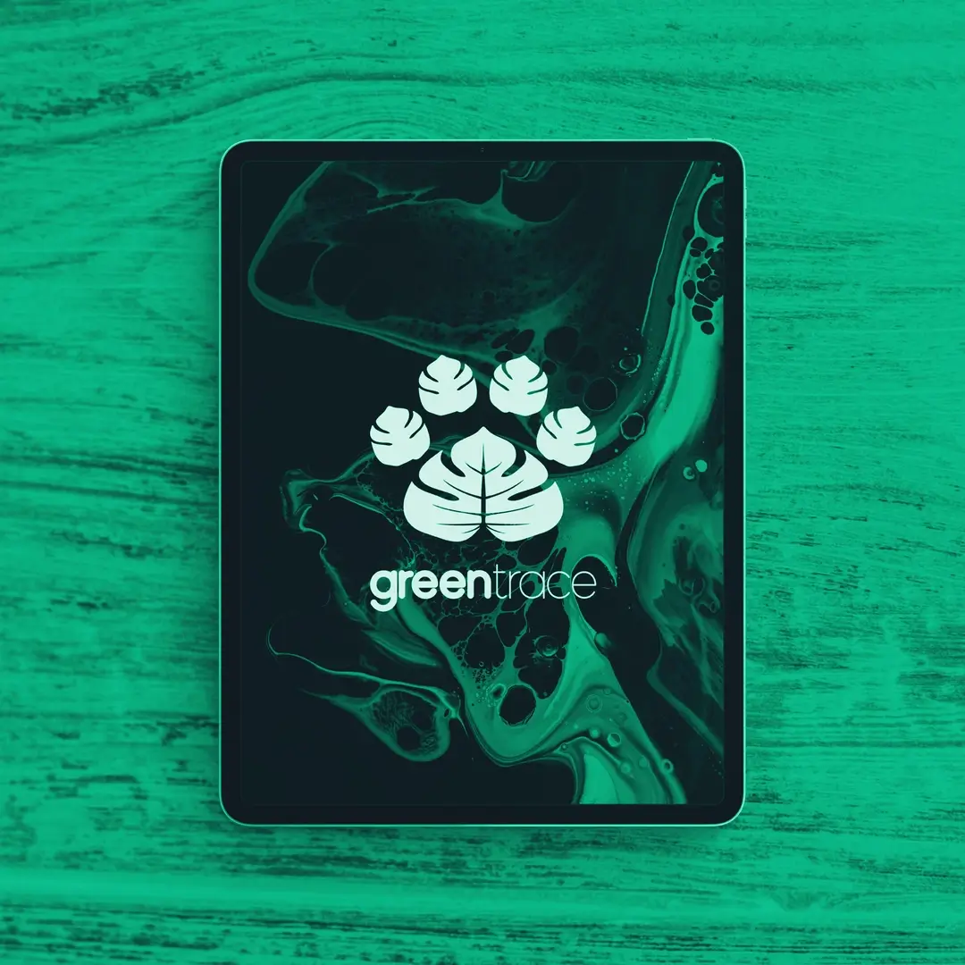 Greentrace cover image: a tablet on a wooden tabletop.